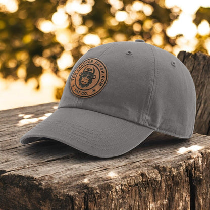 a gray hat sitting on top of a wooden bench