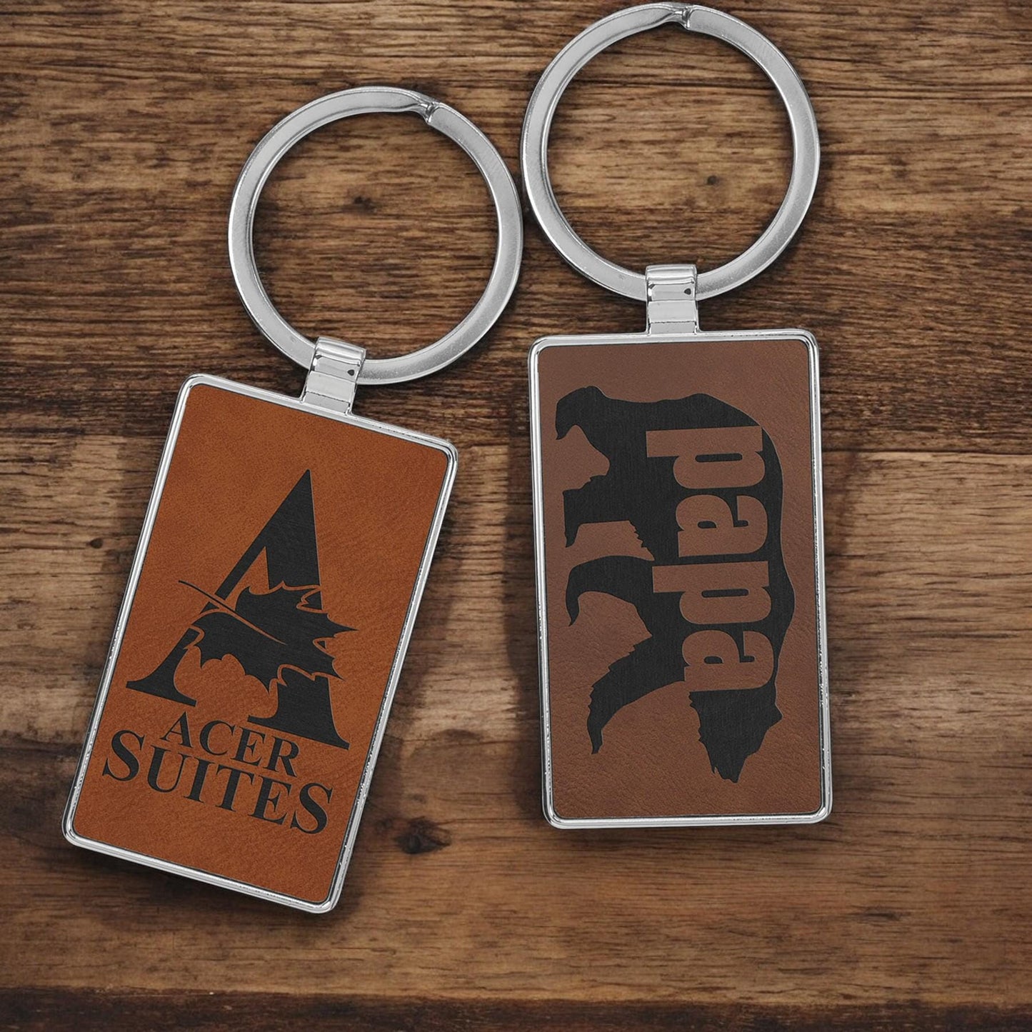 a couple of key chains sitting on top of a wooden table